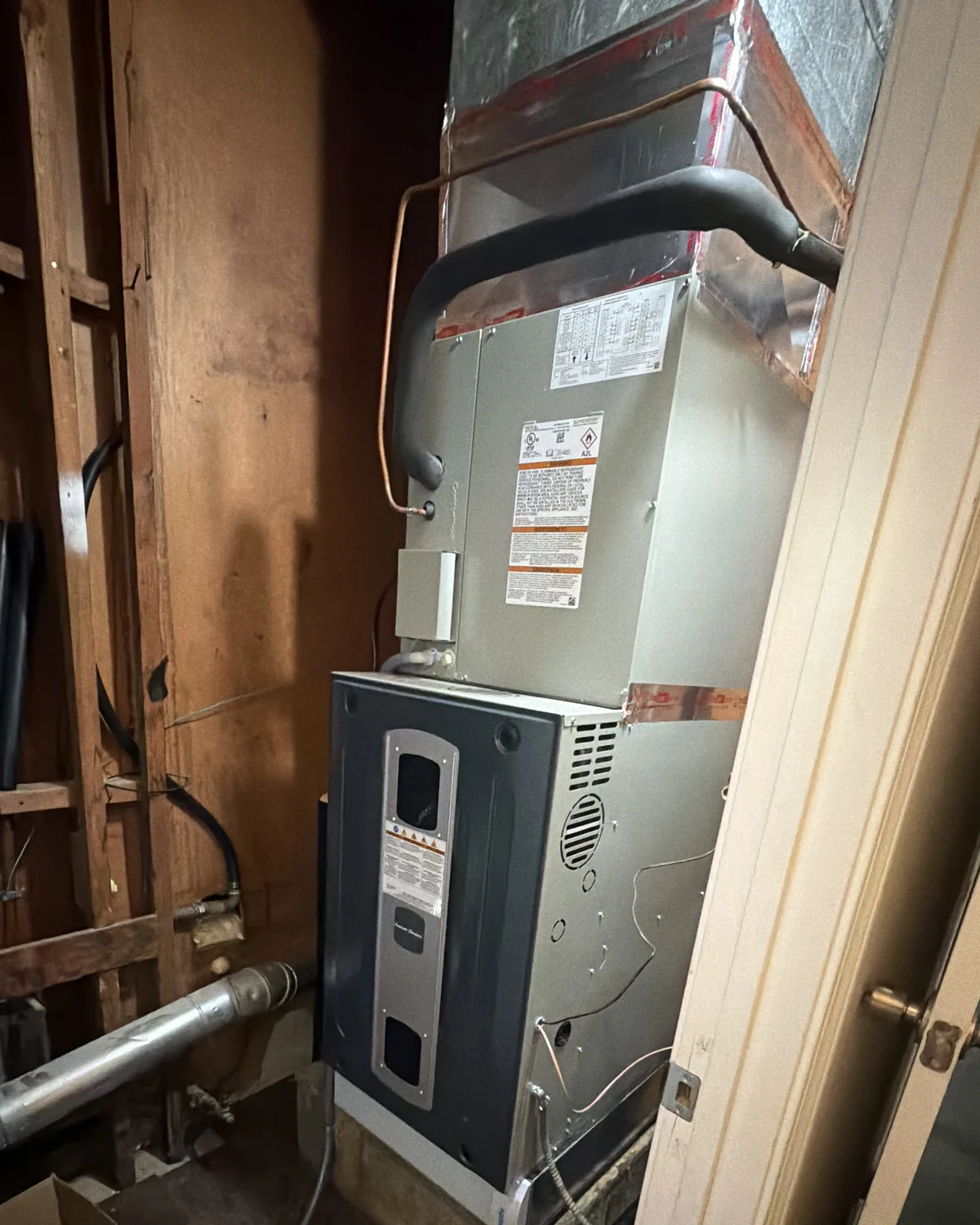 Indoor furnace with a coil cabinet and sheet-metal supply ductwork